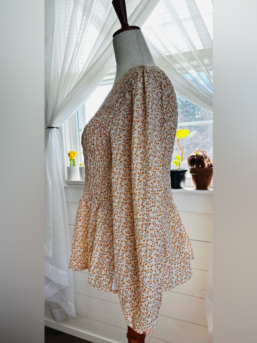 Lumiere long sleeve feminine Floral Print Smocked Peplum Top. 
Size: Small - Picture 4 of 11